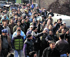 Employees hold a protest in Srinagar on Wednesday. 