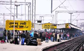 IN WAIT Passengers wait for trains at the railway station in Jammu on Wednesday