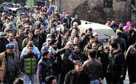Employees hold a protest in Srinagar on Wednesday
