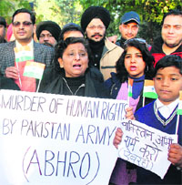Activists of the Akhil Bharatiya Human Rights Organisation holds a protest against the killing of Indian soldiers, in Amritsar on Thursday.