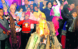 Residents celebrate Kudiyan di Lohri at the Sukhna Lake in Chandigarh on Thursday