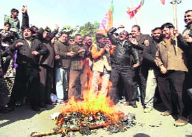 BJP workers burn an effigy of Pakistan in Dehradun on Thursday in protest against the killing of two Indian soldiers