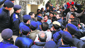 People scuffle with the police at the IGMC in Shimla on Thursday. 