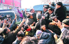 Government employees raise slogans during a protest in Srinagar on Thursday