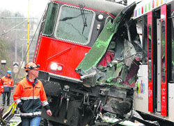 A rescue personnel at the site of a train collision, in which several persons were injured, in the northern Swiss town of Neuhausen am Rheinfall on Thursday.  Reuters