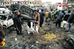 A security official inspects the scene of a blast in Quetta on Thursday.  Reuters