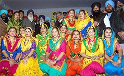 Chief Minister Parkash Singh and Member of Parliament from Bathinda, Harsimrat Kaur Badal, at a Lohri function organised in Bathinda on Friday. Also seen in the picture are Education Minister, Sikander Singh Maluka, Bathinda Mayor Baljit Singh Beerbehman and Chief Parliamentary Secretary Sarup Chand Singla