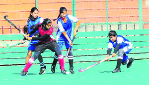 Players in action during a hockey match between Chandigarh and J&K at the Hockey Stadium, Sector 42, in Chandigarh on Friday. 