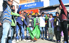 ABVP activists burn a Pakistani flag in Mandi on Friday.