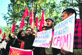 CPM activists protest against the attacks on party members in West Bengal, in Shimla on Friday. 