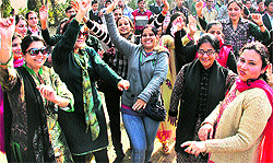Teachers and students of St. Soldier G roup of Institutuions dance during the Lohri celebrations in Jalandhar