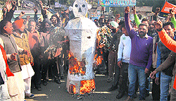 Members of Taal-Mel Committee burn an effigy of Pakistan in Jalandhar on Friday