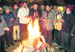 Industry Minister Anil Joshi celebrates Lohri in Amritsar on Saturday. photo: sameer sehgal