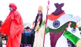 A child dressed as Swami Vivekananda and a girl as Bharat Mata during a special procession in Haridwar on Saturday.