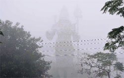 classic view of a Lord Shiva statue on a foggy day at Swami Vivekananda Park, along the Dehradun-Haridwar National Highway in Haridwar on Saturday. Tribune photo: Rameshwar Gaur