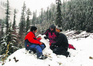 Tourists make a snowman near Kothi near Manali on Saturday.
