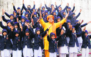 Schoolchildren celebrate the 150th birth anniversary of Swami Vivekananda in Dharamsala on Saturday.