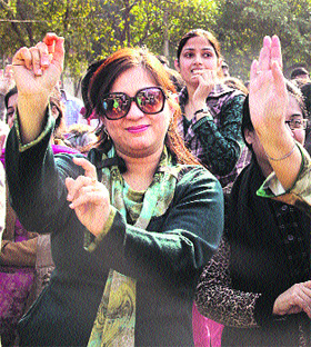 City residents participtate in Lohri celebrations, giving a message Save Girl, Save Child in Jalandhar on Saturday.
