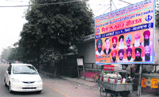 An illegal hoarding which was removed a few days ago is back at the site outside the tehsil complex in Jalandhar.