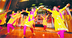 Girls perform on the stage during Lohri celebrations at Government Womens College, Gandhi Nagar, in Jammu on Saturday