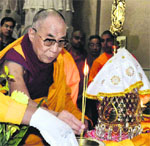 Tibetan spiritual leader the Dalai Lama prays at the Sarnath Temple in Varanasi on Saturday. PTI
