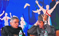 fight against hiv: Minister for Health and Family Welfare Ghulam Nabi Azad and Minister of Railways Pawan Kumar Bansal interact at a closing function of Red Ribbon Express, an exhibition on HIV/AIDS, at Safdarjung railway station in New Delhi on Saturday. While Azad pitched for achieving a zero new infection era, Bansal announced the use of trains to popularise health-related social welfare schemes. Tribune photo: Manas Ranjanj Bhui 