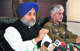 Force-ful: Punjab Deputy Chief Minister Sukhbir Singh Badal, accompanied by state DGP Sumedh Singh Saini at a press conference recently