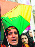 A pro-Kurdish demonstrator at a protest against execution-style killings of three Kurdish women activists in Paris, in central Istanbul on Saturday. Reuters