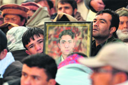 The portrait of a bombing victim is seen during a demonstration by Shiite Muslims at Quetta in Pakistan on Saturday. AFP