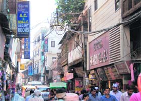 Numerous hotels located on a narrow street in Amritsar
