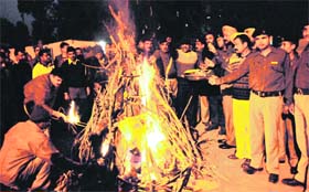In festive spirit: CRPF personnel celebrate Lohri in Amritsar on Sunday