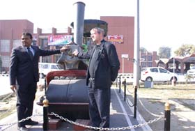 Derek Rayner, vice-chairman of the RRA, UK, along with Ferozepur DRM NC Goyal install the traditional horse logo on the vintage steam road roller of British origin, in Ferozepur