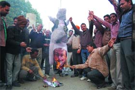 Venting ire: Parasram Nagar residents burn an effigy of Lashkar-e-Toiba founder Hafiz Saeed in the light of a brutal attack on Indian soldiers in Jammu and Kashmir, in Bathinda on Sunday