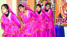 Schoolgirls perform a dance during a Vaishya community function in Haridwar on Sunday.