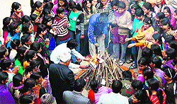 Women celebrate birth of girls at Khairekan village in Sirsa and (right) students of Government College for Women celebrate Lohri in Gurgaon on Sunday