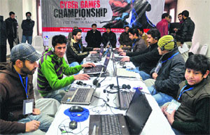 Participants play games on laptops at the Kashmir Cyber Games Championship 2013 in Srinagar. 