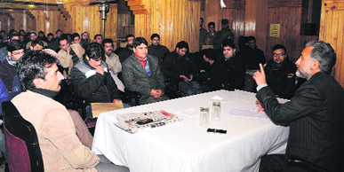 GN Var, chairman, Private Coaching Centres Association, addresses a meeting of coaching centre owners in Srinagar on Sunday. 