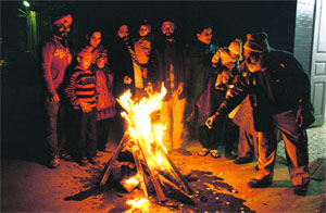 Residents celebrate Lohri in Ludhiana. 