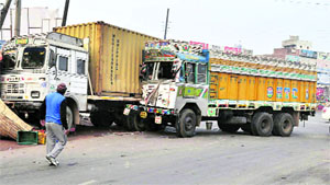 The two trucks that rammed into vends at Dehlon Chowk near Ahmedgarh on Sunday. 