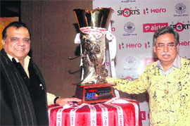 Hockey India League (HIL) Chairman Narinder Batra along with the sponsors unveil the trophy in New Delhi on Sunday.