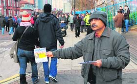 Missing Son: Santanu Pal, father of Souvik Pal, distributes leaflets appealing for information regarding the wherabouts of his son in Manchester, England, on Sunday. Souvik (18) has been missing since New Years Eve.