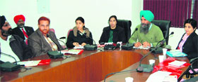 Ranjit Singh Buttar (Centre) Distric Health and Family Welfare Officer addresses a workshop of health officials in Amritsar on Monday.