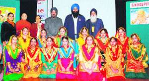 Canadian MP Tim Uppal with students of Chief Khalsa Diwan upon his arrival at Sri Guru Harkrishan Senior Secondary School in Amritsar on Monday.