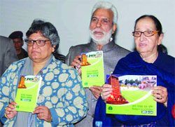 NDMC chairperson Archna Arora and vice-chairperson Tajdar Babar release the Budget Speech 2013-14 in the council building in New Delhi on Monday. Tribune photo: Manas Ranjan Bhui