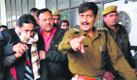 Doon MLA Ram Kumar Chaudhary being produced in a Panchkula court on Monday. 