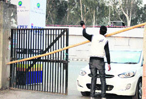 A private security guard stops entry to Buriton Park two days ahead of the forthcoming Indian Hockey League in Jalandhar on Monday. 