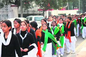 Girls coming out from the MA stadium after participating in the Republic Day rehearsels in Jammu on Monday. 