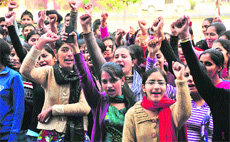 PAU students hold a protest outside Thapar Hall in Ludhiana on Monday.