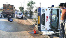 An MC vehicle lies overturned on the Hambran road after a mishap in Ludhiana on Monday.