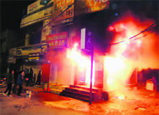 The ATM booth of Axis Bank that caught fire at Jargaon on Sunday night .